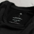 close up of black merino wool t-shirt neck label