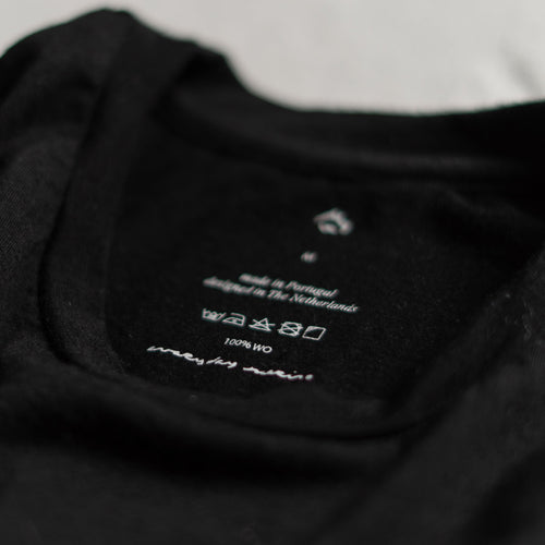 close up of black merino wool t-shirt neck label