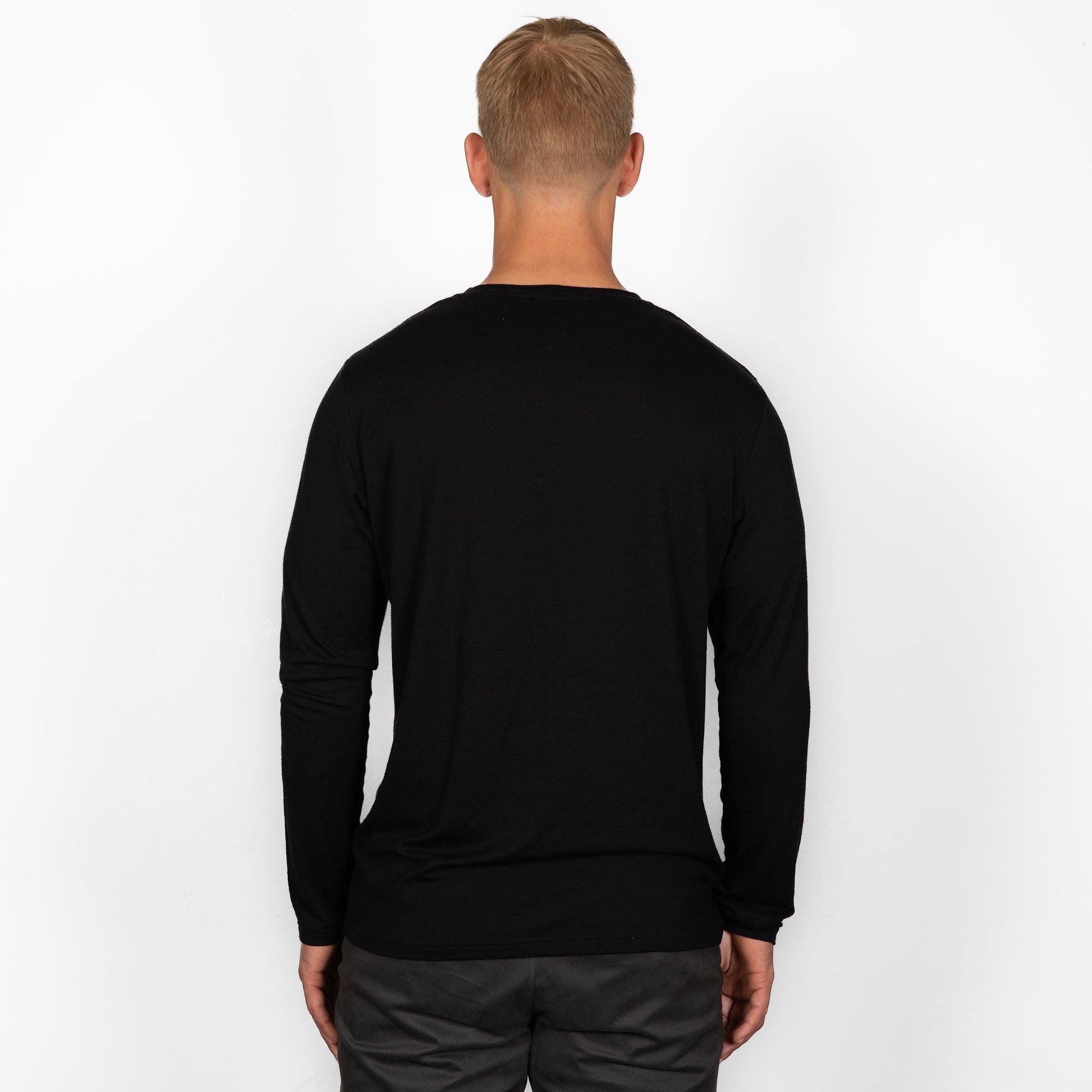 model wearing black merino wool longsleeve from back