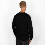model wearing black merino wool longsleeve from side back