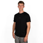 model wearing black merino wool t-shirt from side