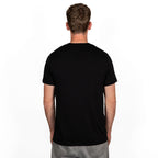 model wearing black merino wool t-shirt from back